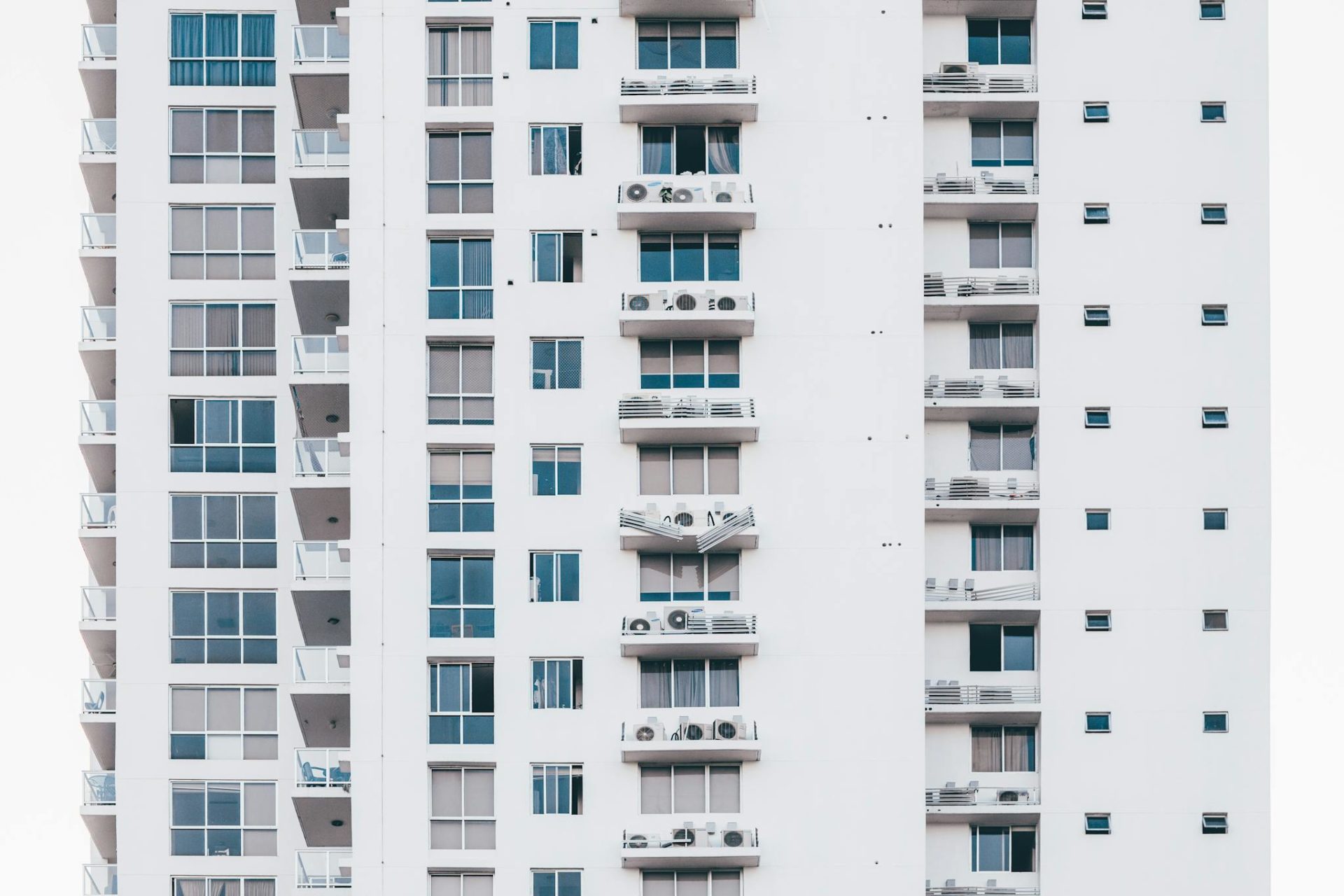 Minimalist Photography of White and Gray Condominium